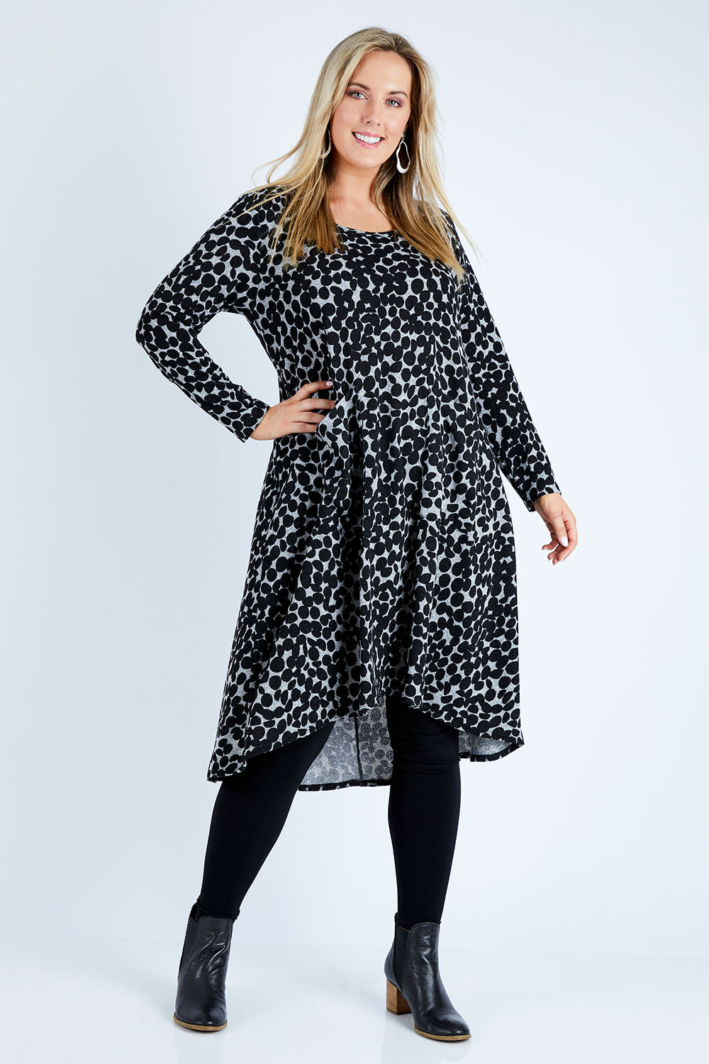 Model Jess wearing size 12 of the Belle Wooly Knit Dress in colour Greydot (Grey), from the front, showing the whole outfit