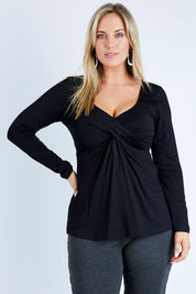 Model Jess wearing size 12 of the Belle Long Sleeve Cross Front Tee in colour Black (Black), from the front, cropped image