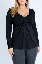 Model Jess wearing size 12 of the Belle Long Sleeve Cross Front Tee in colour Black (Black), from the front, cropped image