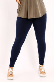 Model Sasha-Lee wearing size 16 of the Belle Legging in colour Navy (Blue), from the front, cropped image