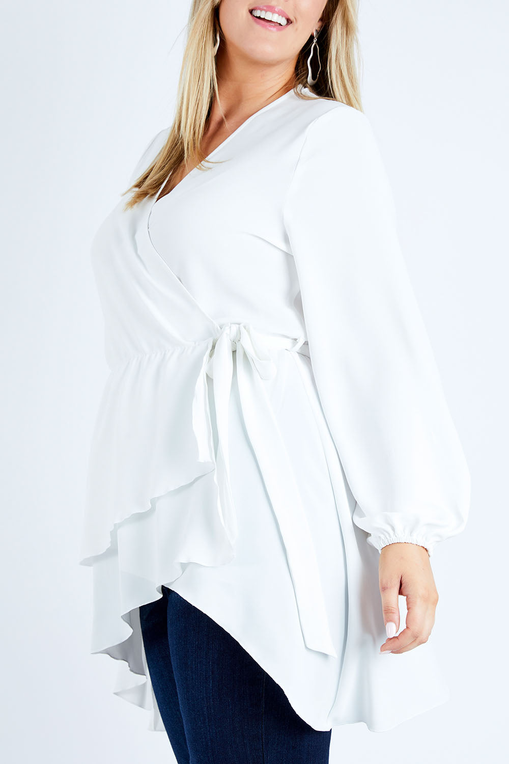 Model Jess wearing size 12 of the Belle Flowy Blouse in colour Offwhite (White), from the front, cropped image