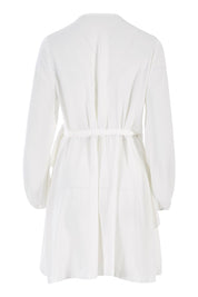 Product shot of the Belle Flowy Blouse in colour Offwhite (White), from the back