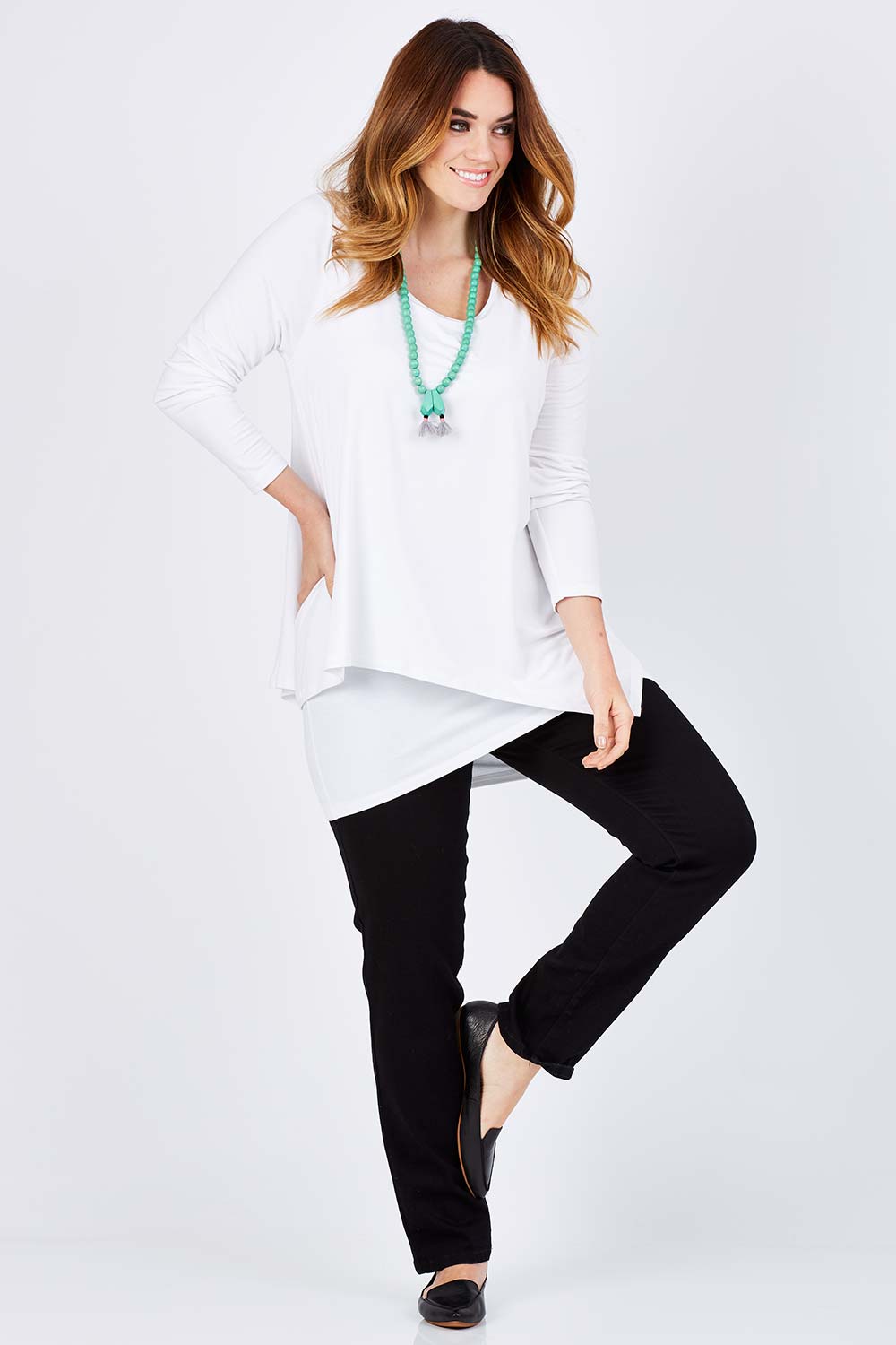 Model Laura wearing size 12 of the Belle Forgiver Tunic in colour White (White), from the front, showing the whole outfit