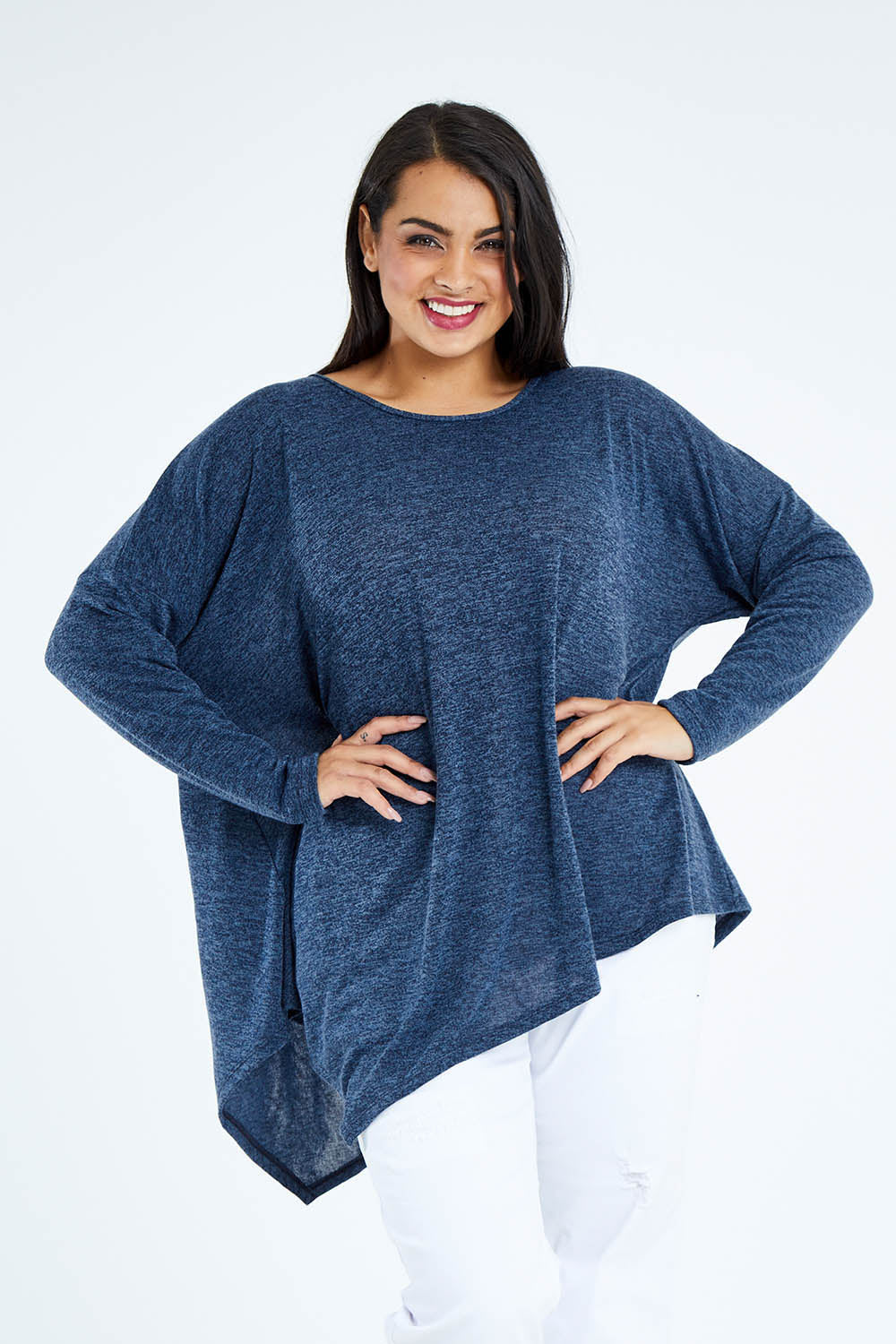 Model Sasha-Lee wearing size 16 of the Belle Wooly Knit Throw Over in colour Denimblue (Blue), from the front, cropped image
