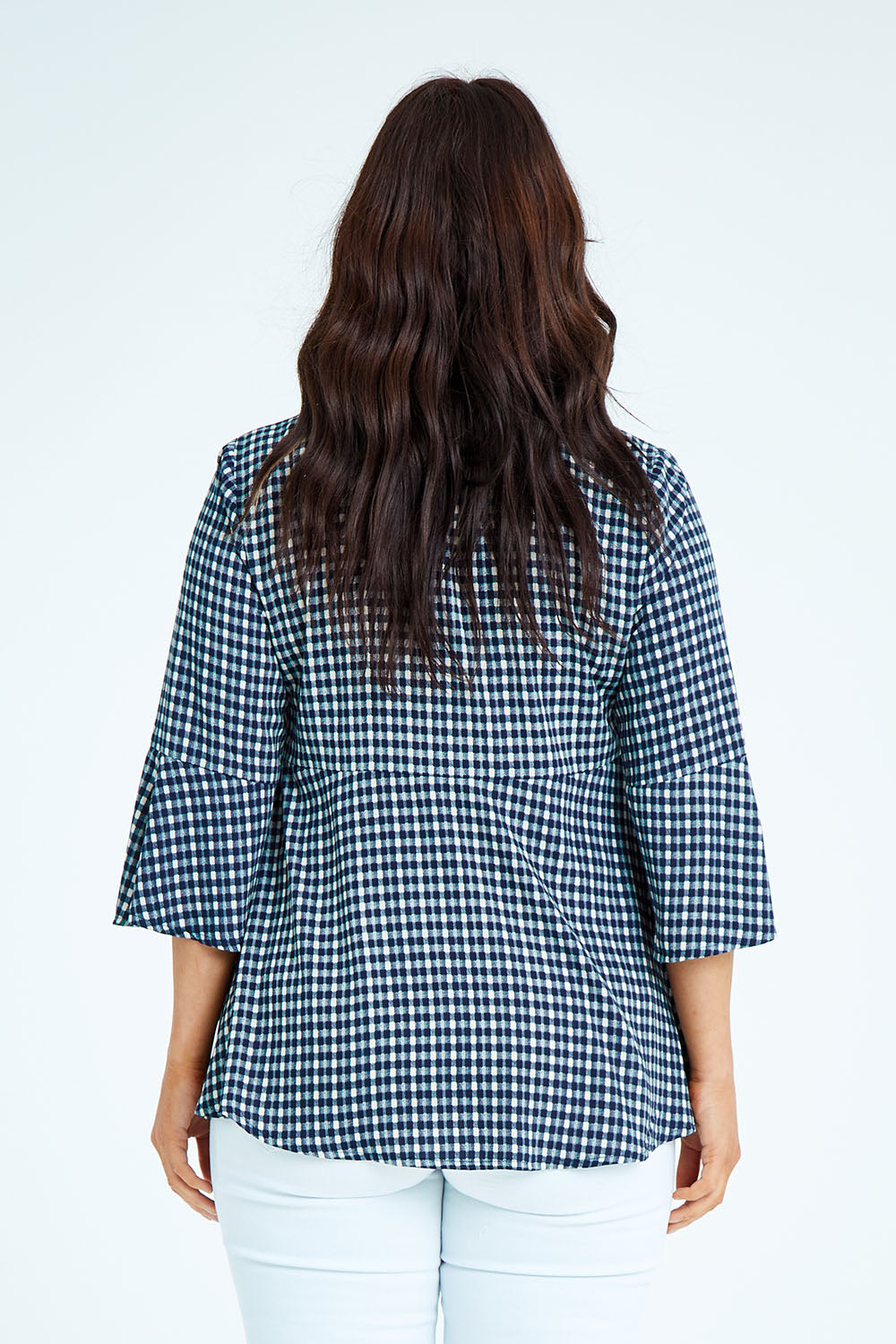 Model Laura wearing size 12 of the Belle Seam Detail Check Blouse in colour Check (Blue), from the back