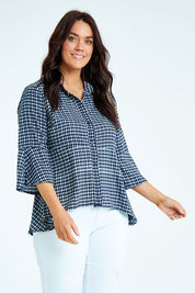 Model Laura wearing size 12 of the Belle Seam Detail Check Blouse in colour Check (Blue), from the front, cropped image