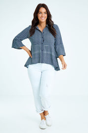 Model Laura wearing size 12 of the Belle Seam Detail Check Blouse in colour Check (Blue), from the front, showing the whole outfit