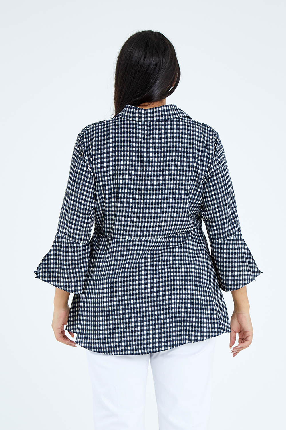 Model Sasha-Lee wearing size 16 of the Belle Seam Detail Check Blouse in colour Check (Blue), from the back