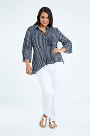Model Sasha-Lee wearing size 16 of the Belle Seam Detail Check Blouse in colour Check (Blue), from the front, showing the whole outfit