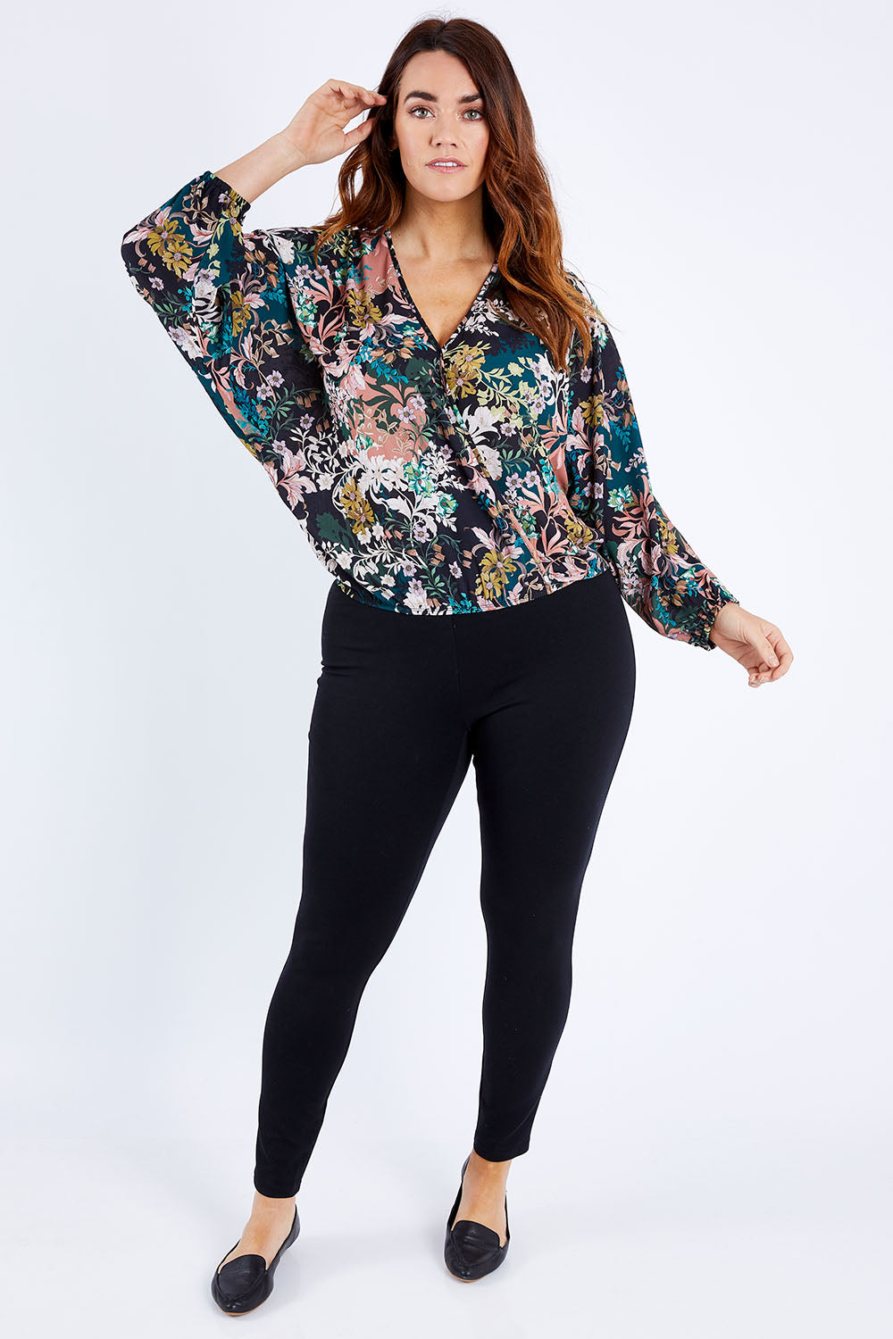 Model Laura wearing size 12 of the Belle Blossom Floral Wrap Top in colour Blossom, from the front, showing the whole outfit
