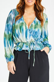 Model Laura wearing size 12 of the Belle Tie Dye Top in colour Tiedye (Blue), from the front, cropped image