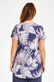 Model Laura wearing size 12 of the Belle Fern Print Top in colour Fern (Blue), from the back