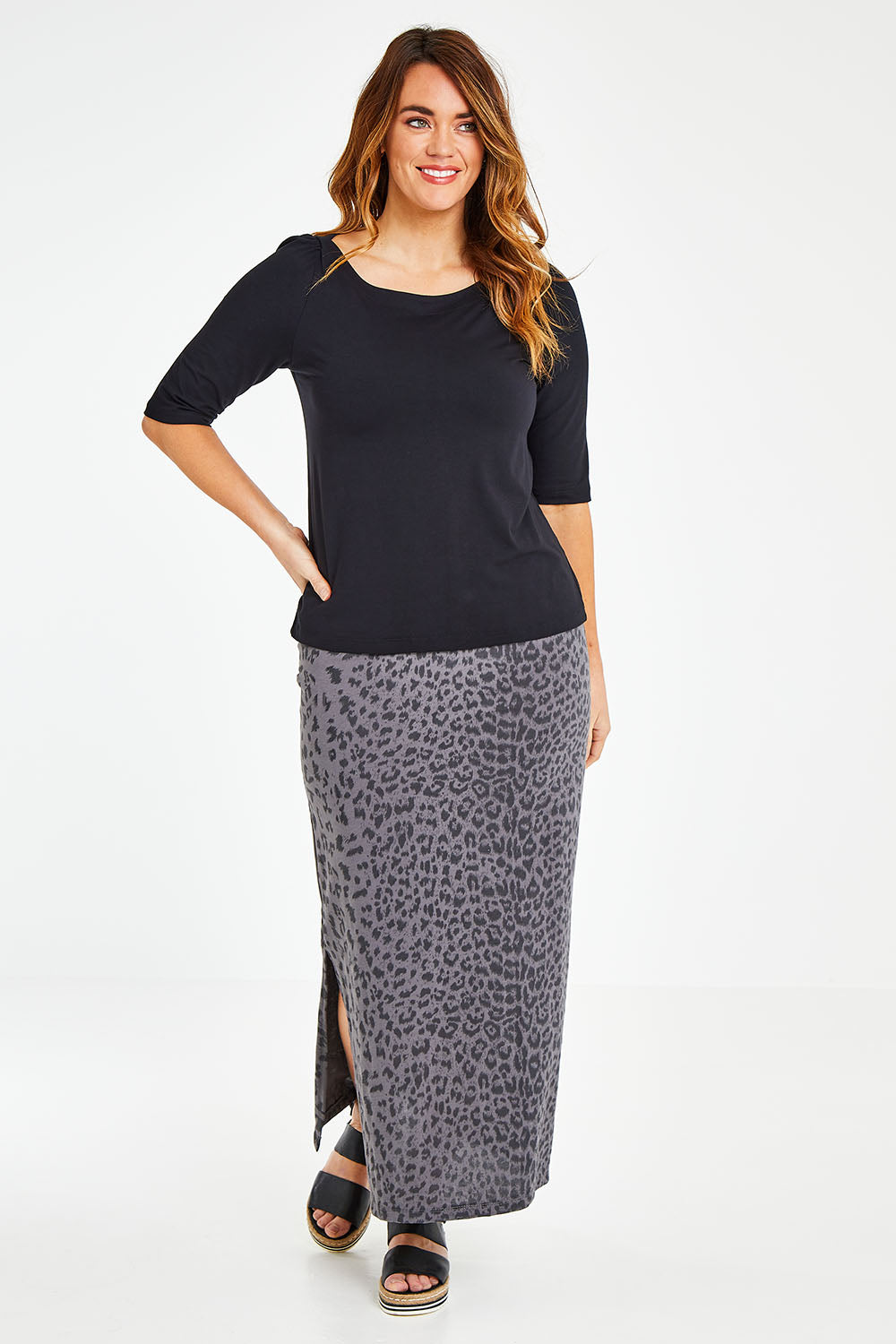 Model Laura wearing size 12 of the Belle Boat Neck Tee in colour Black (Black), from the front, showing the whole outfit