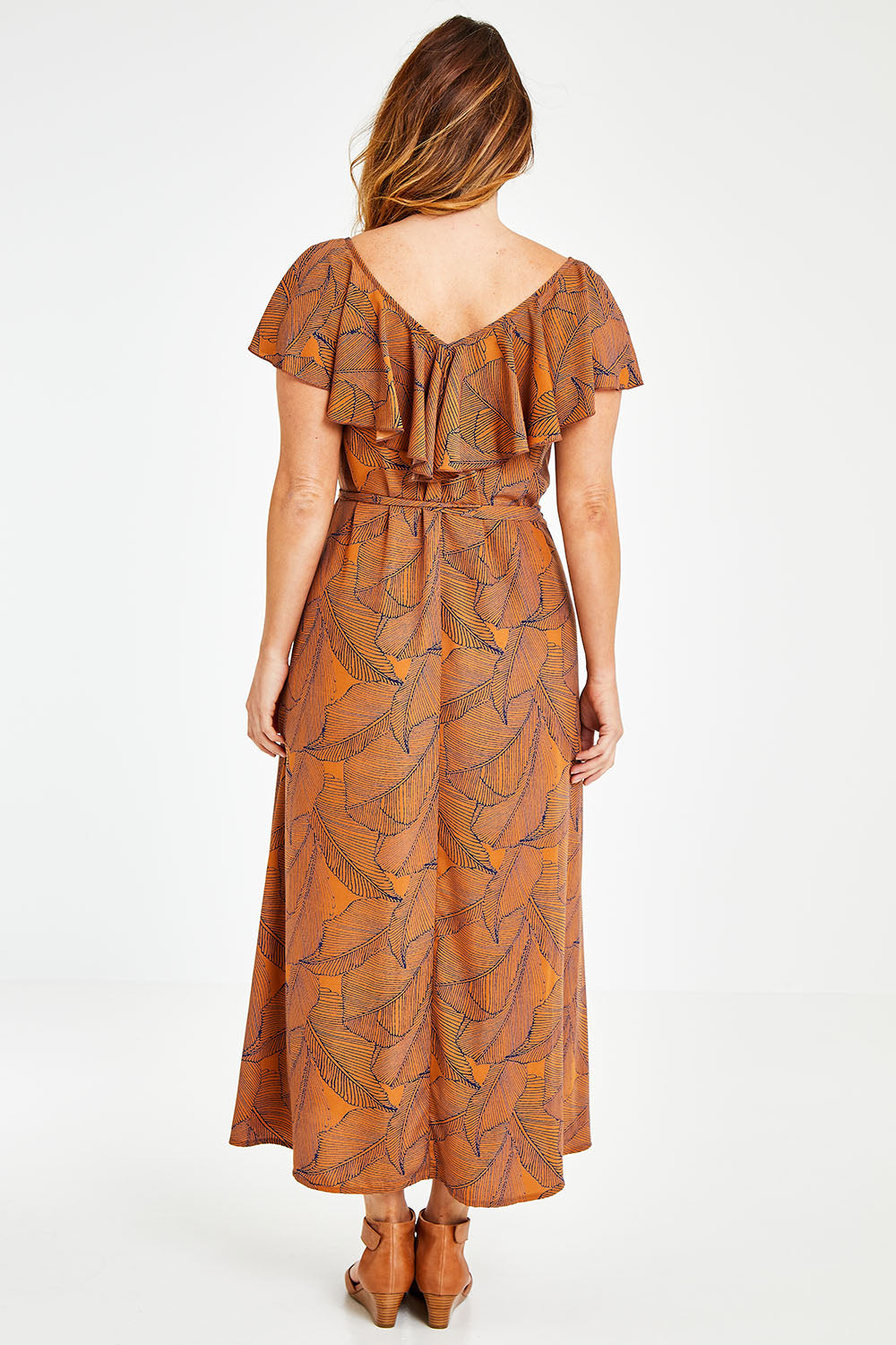 Model Laura wearing size 12 of the Belle Frill Trim Maxi Dress in colour Monoprint, from the back