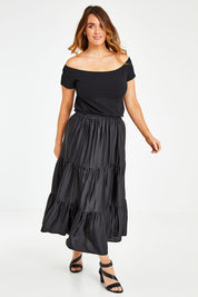 Model Laura wearing size 12 of the Belle Slinky Tiered Skirt in colour Black (Black), from the front, showing the whole outfit