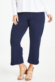 Model Laura wearing size 12 of the Belle Fashion Knit Pant in colour Navy (Blue), from the front, cropped image