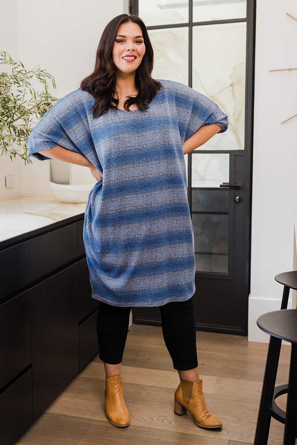 Model Lauren wearing size 16 of the Belle Side Drape Stripe Dress in colour Stripe (Blue), from the front, showing the whole outfit