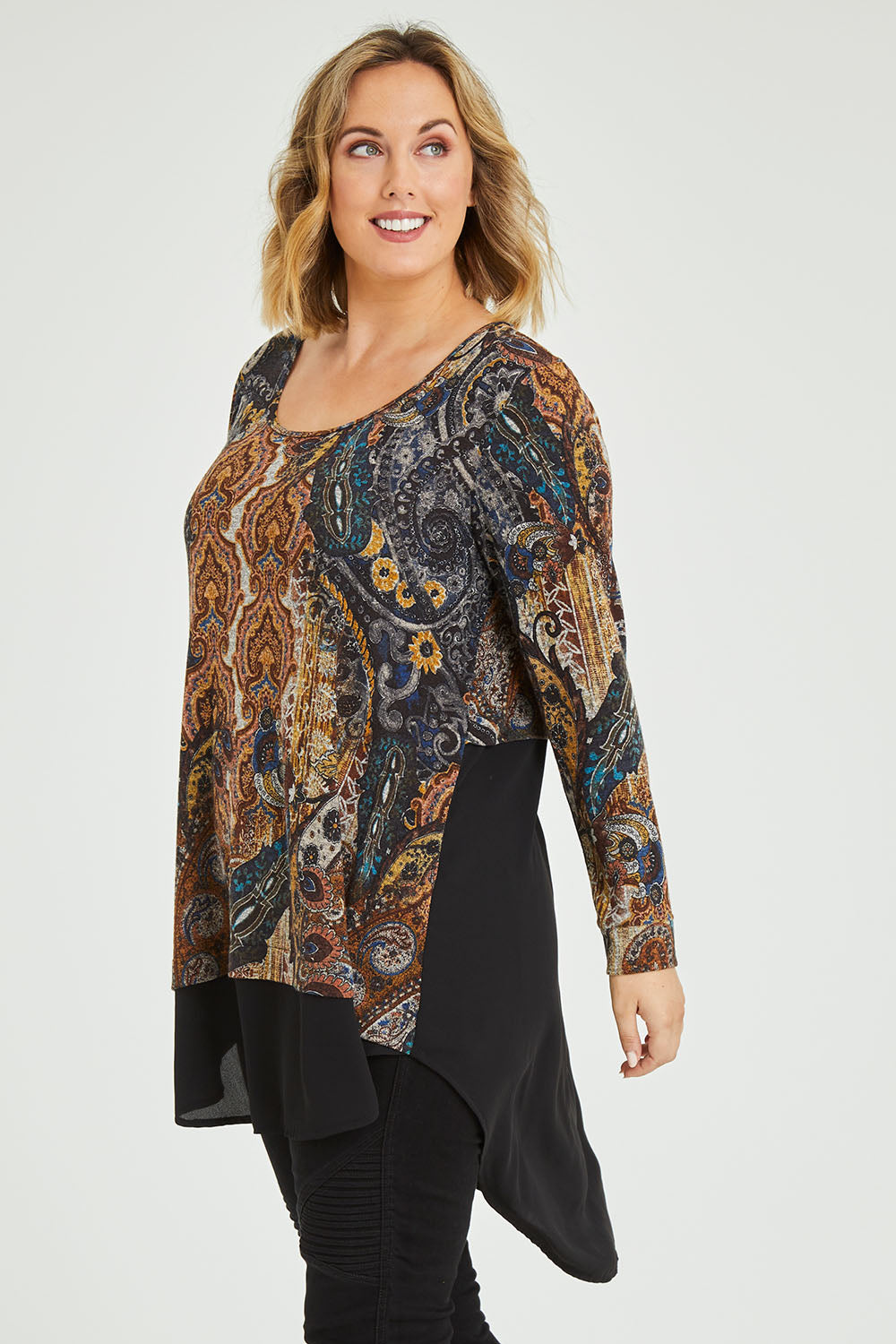 Model Jess wearing size 12 of the Belle Paisley Mixed Fabric Tunic in colour Paisley, from the front, cropped image