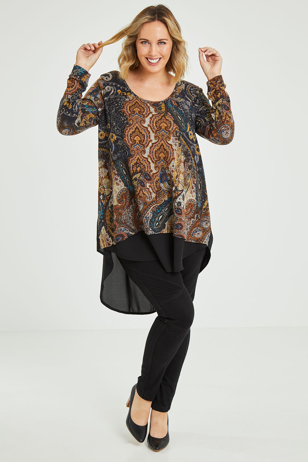 Model Jess wearing size 12 of the Belle Paisley Mixed Fabric Tunic in colour Paisley, from the front, showing the whole outfit
