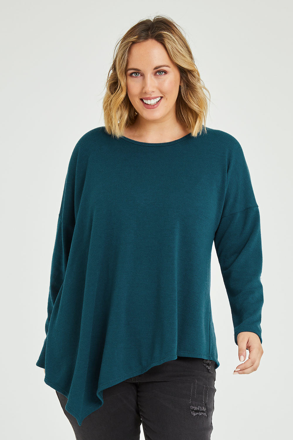 Model Jess wearing size 12 of the Belle Winter Warm Knit Throw Over in colour Teal (Blue), from the front, cropped image