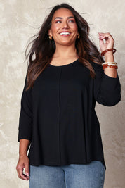 Model Ashleigh wearing size 14 of the Belle Luxe Bamboo Spliced Tee in colour Black (Black), from the front, showing the whole outfit