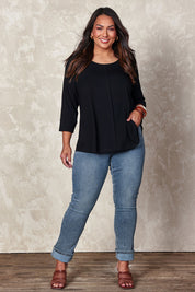 Model Ashleigh wearing size 14 of the Belle Luxe Bamboo Spliced Tee in colour Black (Black), from the front, showing the whole outfit