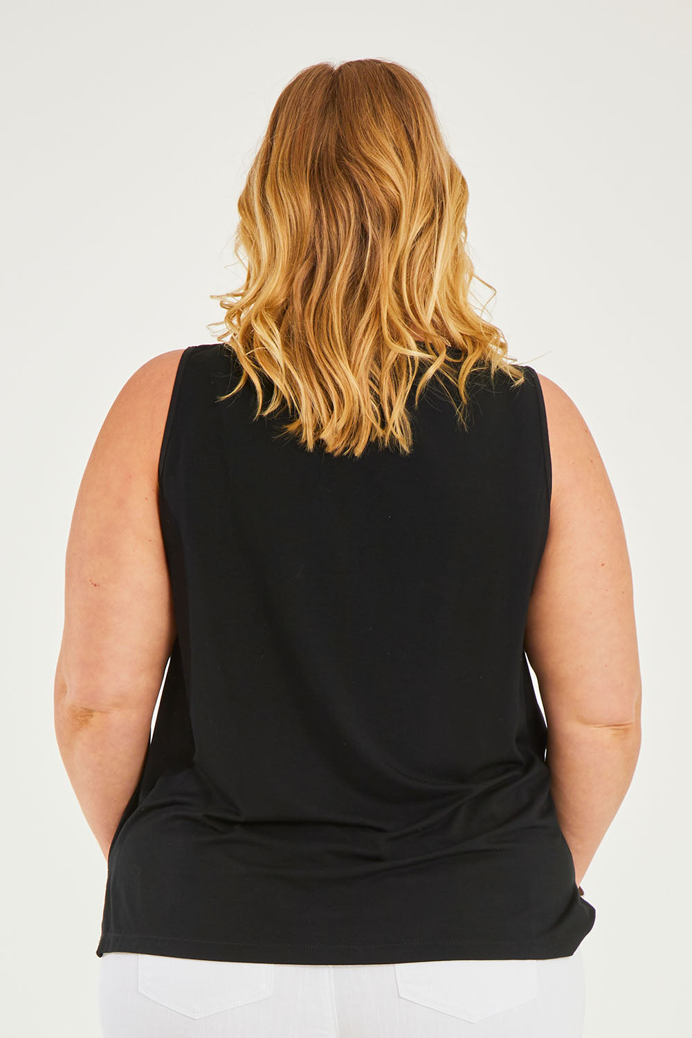 Model Caitlin wearing size 20 of the Belle Luxe Bamboo Tank in colour Black (Black), from the back