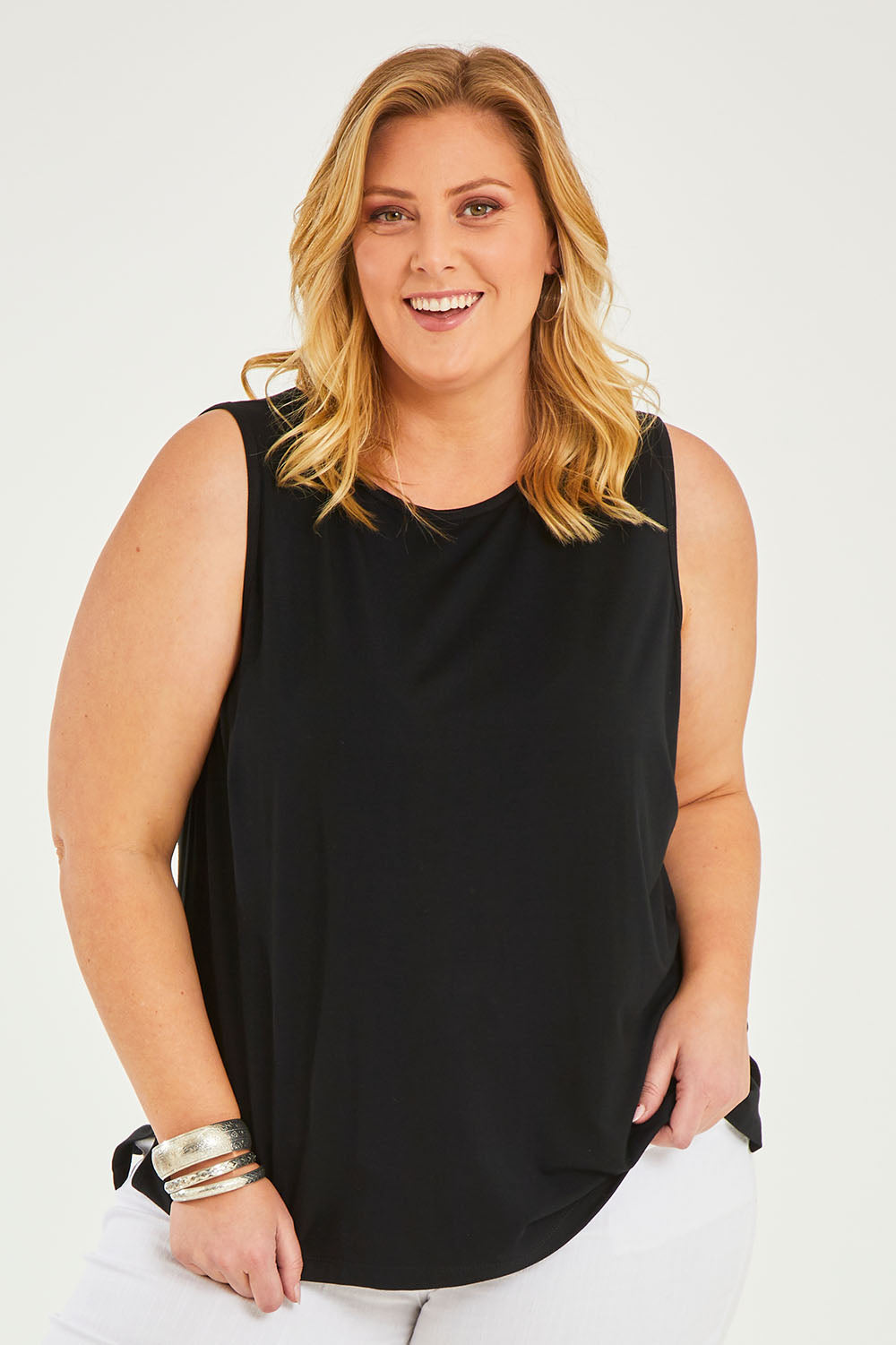 Model Caitlin wearing size 20 of the Belle Luxe Bamboo Tank in colour Black (Black), from the front, cropped image
