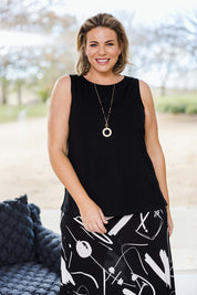 Model Fiona wearing size 16 of the Belle Luxe Bamboo Tank in colour Black (Black), from the front, showing the whole outfit