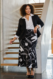 Model Alexis wearing size 18 of the Belle Fit & Flare Printed Skirt in colour Blackwhite (Black), from the front, showing the whole outfit