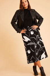 Model Monique wearing size 14 of the Belle Fit & Flare Printed Skirt in colour Blackwhite (Black), from the front, showing the whole outfit