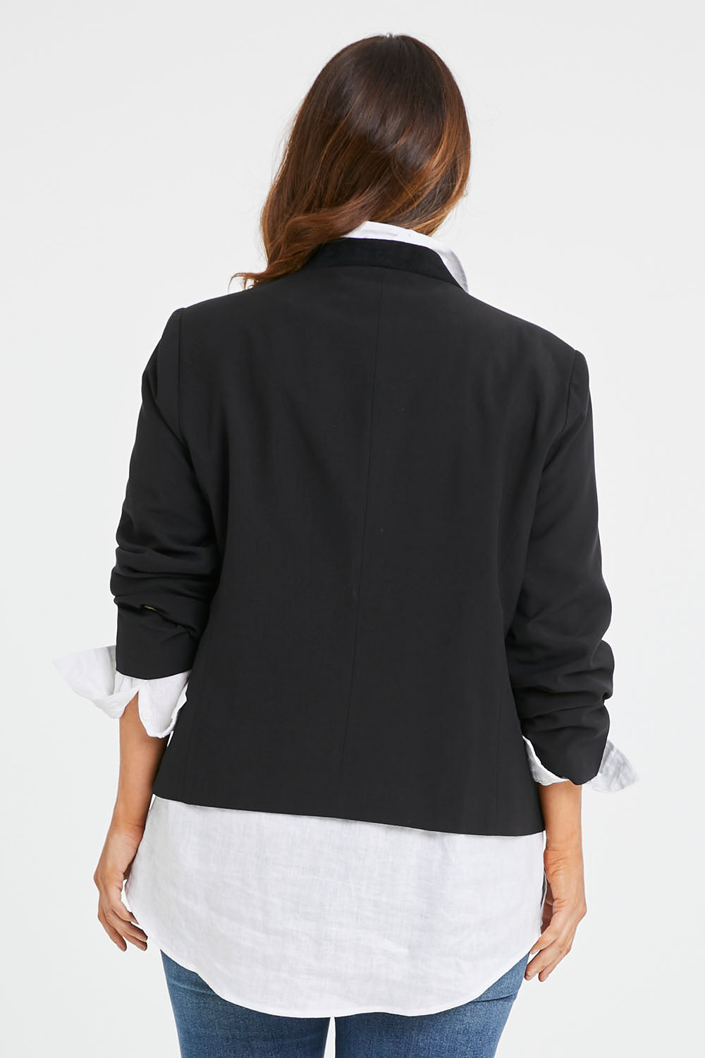 Model Laura wearing size 14 of the Belle Eyelet Detail Blazer in colour Black (Black), from the back