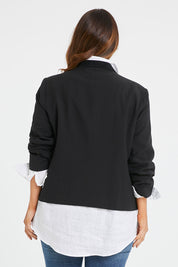 Model Laura wearing size 14 of the Belle Eyelet Detail Blazer in colour Black (Black), from the back