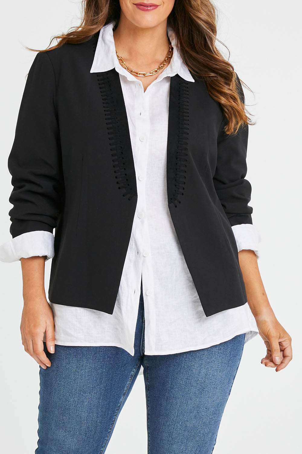 Model Laura wearing size 14 of the Belle Eyelet Detail Blazer in colour Black (Black), from the front, cropped image