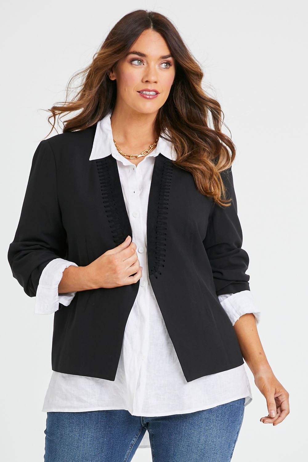 Model Laura wearing size 14 of the Belle Eyelet Detail Blazer in colour Black (Black), from the front, cropped image
