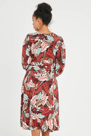 Model Noli wearing size 14 of the Belle Full Sleeve Print Dress in colour Floral (Red), from the back