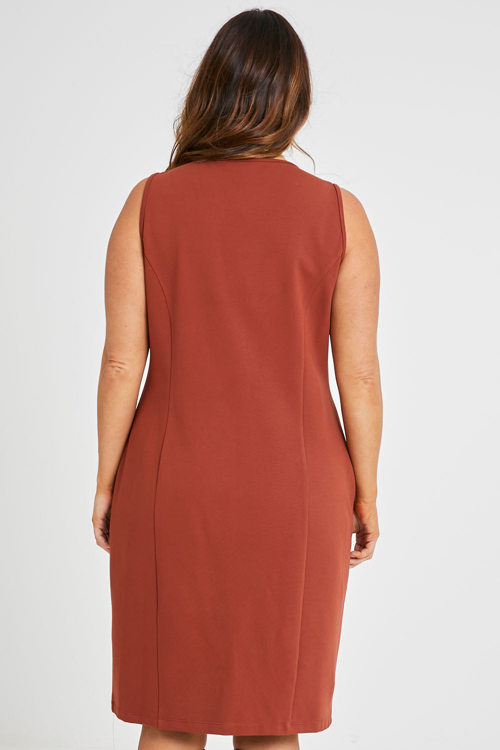 Model Laura wearing size 14 of the Belle Classic Ponte Sleeveless Dress in colour Ochrerust, from the back