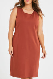 Model Laura wearing size 14 of the Belle Classic Ponte Sleeveless Dress in colour Ochrerust, from the front, cropped image