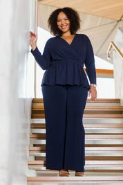 Model Alexis wearing size 18 of the Belle X Over Long Sleeve Tee in colour Navy (Blue), from the front, showing the whole outfit