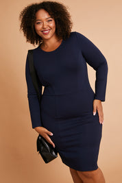 Model Alexis wearing size 16 of the Belle Panelled Ponte Dress in colour Darknavy (Blue), from the front, showing the whole outfit