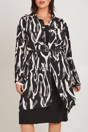 Model Poppy wearing size 16 of the Belle Relaxed Long Printed Shirt in colour Blackivory (Black), from the front, cropped image