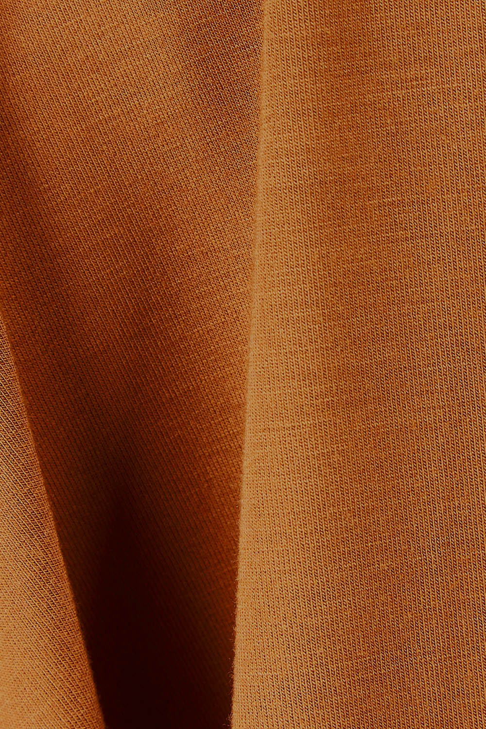Product shot of the Belle Luxe Bamboo V Neck Tee in colour Tawny, detail