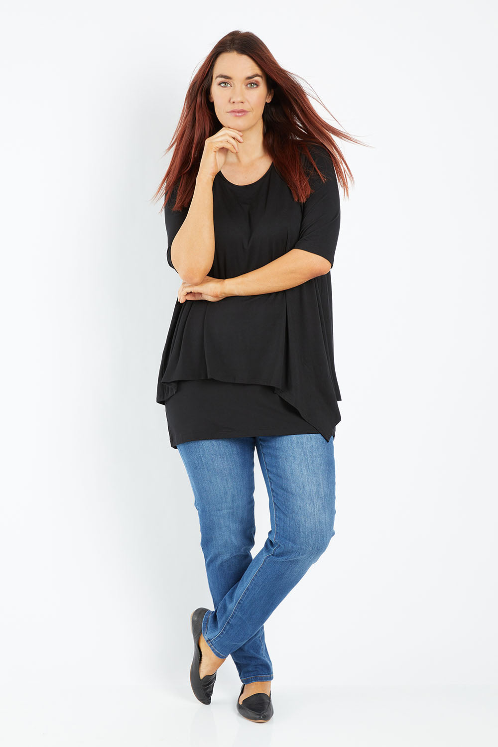 Model Laura wearing size 12 of the Belle Half Sleeve Forgiver Tunic in colour Black (Black), from the front, showing the whole outfit
