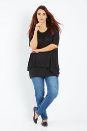 Model Laura wearing size 12 of the Belle Half Sleeve Forgiver Tunic in colour Black (Black), from the front, showing the whole outfit