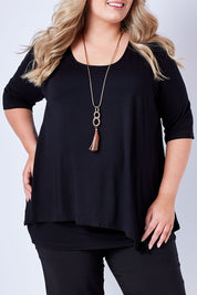 Model Sophie wearing size 20 of the Belle Half Sleeve Forgiver Tunic in colour Black (Black), from the front, cropped image