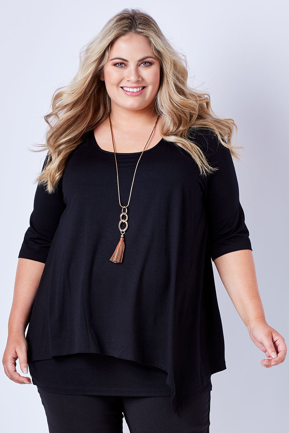 Model Sophie wearing size 20 of the Belle Half Sleeve Forgiver Tunic in colour Black (Black), from the front, cropped image