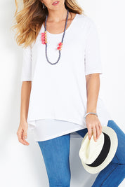 Model Bree wearing size 14 of the Belle Half Sleeve Forgiver Tunic in colour White (White), from the front, cropped image