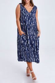 Model Monique wearing size 14 of the Belle V Neck Reversible Dress in colour Navywhite (Blue), from the front, cropped image