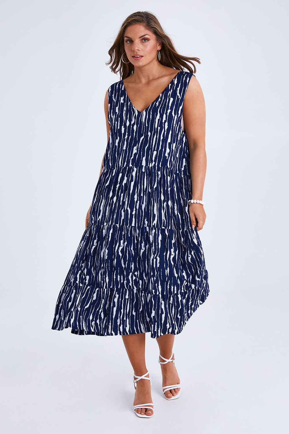 Model Monique wearing size 14 of the Belle V Neck Reversible Dress in colour Navywhite (Blue), from the front, showing the whole outfit