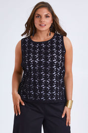 Model Monique wearing size 14 of the Belle Lined Embroided Tank in colour Black (Black), from the front, cropped image